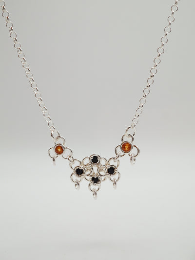 sterling silver TRAME necklace with blue and orange sapphires
