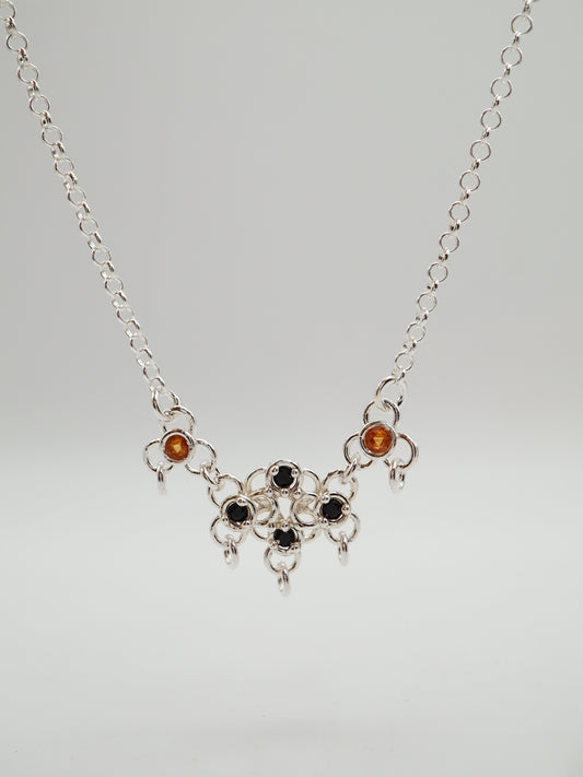 sterling silver TRAME necklace with blue and orange sapphires